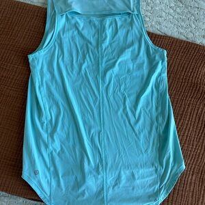Lululemon tank with open slit in back. Light blue color